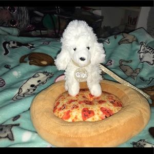 A poodle and the pizza bed